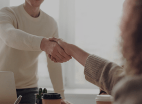 
                    Two hands shaking to represent the collaboration between Laurastar and several other renowned companies.
                    